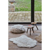 small fluffy white pelt rug wool recycled cotton rounded edges