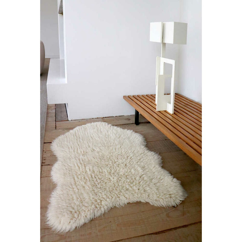 small fluffy white pelt rug wool recycled cotton rounded edges