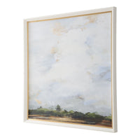 Uttermost's Whispering Cloudscapes Framed Print features a landscape with a cloudy sky and green horizon in a white wood grain frame.