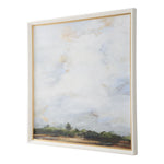 Uttermost's Whispering Cloudscapes Framed Print features a landscape with a cloudy sky and green horizon in a white wood grain frame.