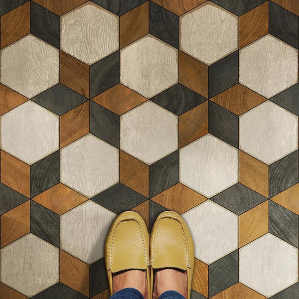 Yellow shoes on the Illuminated Neutron Star Vinyl Floor Runner by Spicher and Company with hexagonal patterned tiles.