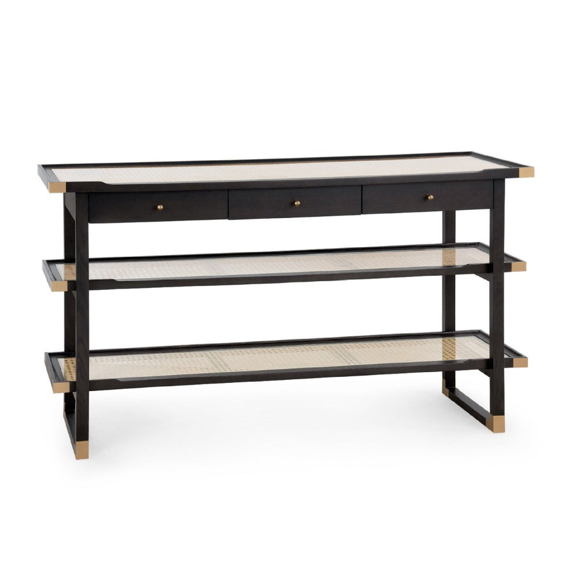 A modern three-tier console table with a black frame, natural woven cane shelves, and three drawers on the top with brass knobs, shown on a white background.