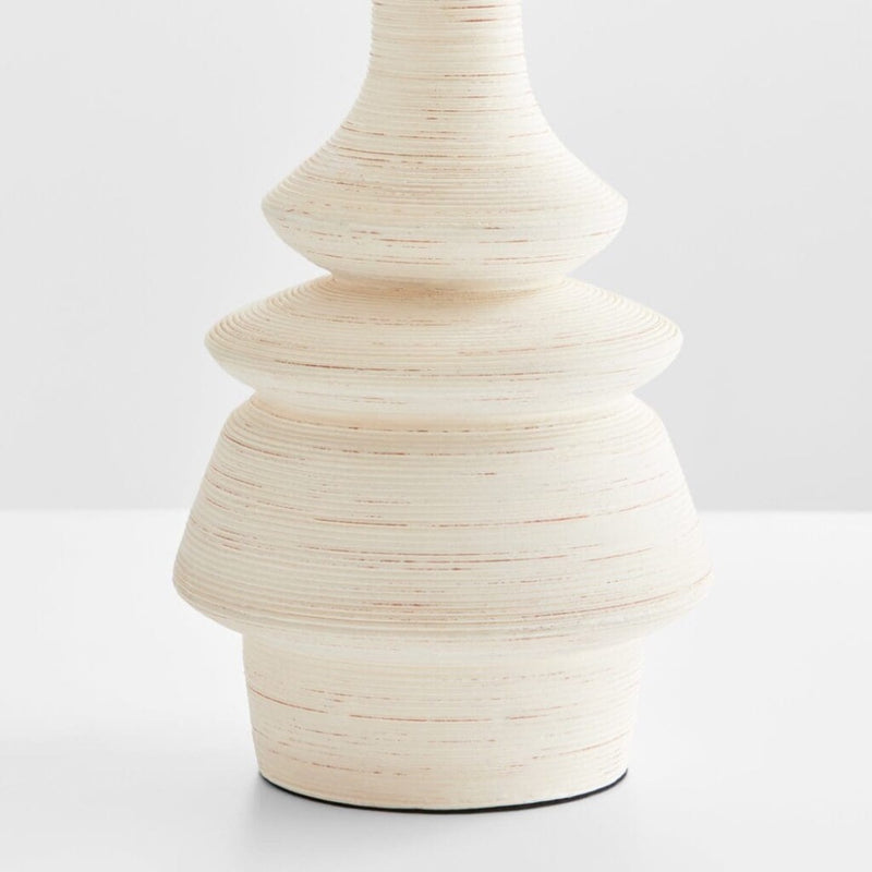 off-white striated ceramic table lamp turned silhouette white linen shade