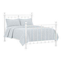 Orchids Lux Home Castile White Metal Bed, wood slats, light blue quilted bedding, 2 pillows & blanket shown.