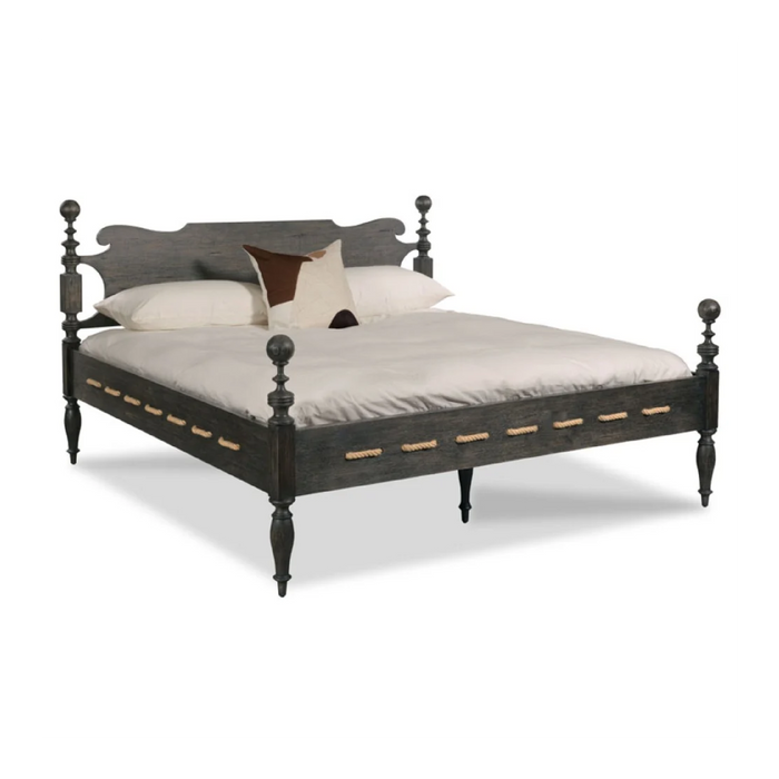 Saltwater Queen Bed Worn Black by Woodbridge Furniture with white bedding and two pillows, one white, one brown.