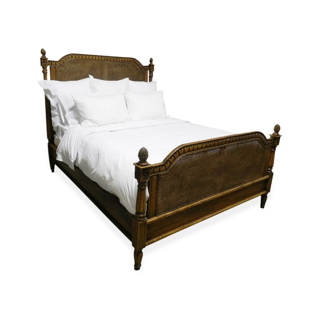 Phillips Scott Bay King Caned Bed in French stain with white bedding, shown against a white backdrop.