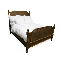 Phillips Scott Bay King Caned Bed in French stain with white bedding, shown against a white backdrop.