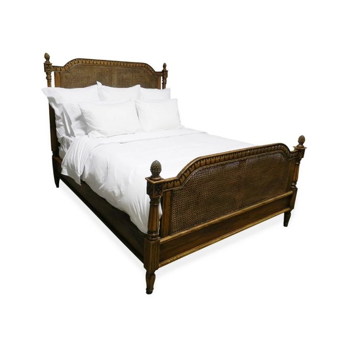 Phillips Scott Bay King Caned Bed in French stain with white bedding, shown against a white backdrop.