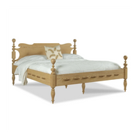 Saltwater Queen Bed Limewash by Woodbridge Furniture with white bedding and a beige floral accent pillow.