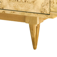 Close-up detail of a mid-century modern sideboard featuring a natural burl wood cabinet and tapered wooden legs on a white background.