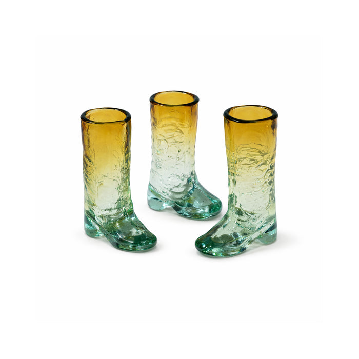 Three glass boot-shaped vases on a white background