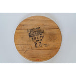 The Bourbon Head Lazy Susan Tray from Sono Inspired is a rustic piece crafted from a wooden bourbon barrel top. It features stamped text and numbers from Jim Beam Distilling Co., all set against a white background, showcasing repurposed materials with timeless charm.