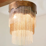round pendant mottled bronze silver chain layers