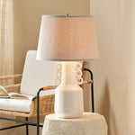white glazed ceramic table lamp circles natural linen cone shade