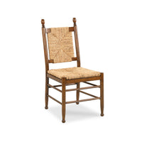 A wooden dining chair with a woven cane backrest and seat, shown on a plain white background.