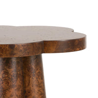 Close-up of a wooden side table with a textured surface on a white background