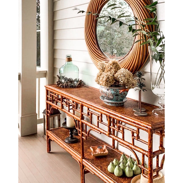 The Kenian Pagoda Rattan + Tortoise Shell Bamboo Console adds Asian-inspired charm and style to your porch.