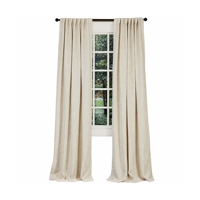Emdee International Boucle Ivory Cotton Curtain Panel on a black rod frames a window with outdoor greenery views.