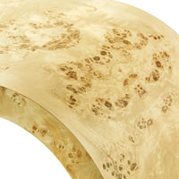 close up view of light wood burl curved edge table