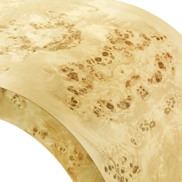 close up view of light wood burl curved edge table