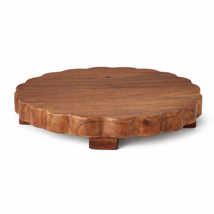 Wooden round table with scalloped edge on a white background
