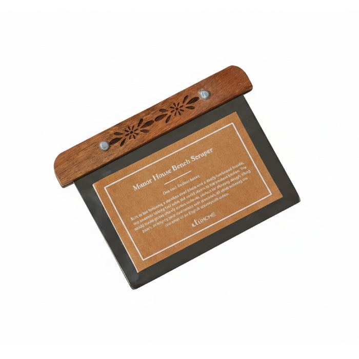 Wooden bench scraper with engraved design on a white background