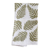 The Green Ferns Flour Sack Kitchen Towel by Muse Textiles, made from 100% heavy duty cotton and featuring green fern leaf patterns scattered throughout, is an eco-friendly addition to any kitchen. This stylish white tea towel is folded and displayed against a white background.
