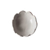 The Scalloped Bloom Nut Bowl by Handmade Studio, a white ceramic bowl with scalloped edges, viewed from above and isolated on a white background.