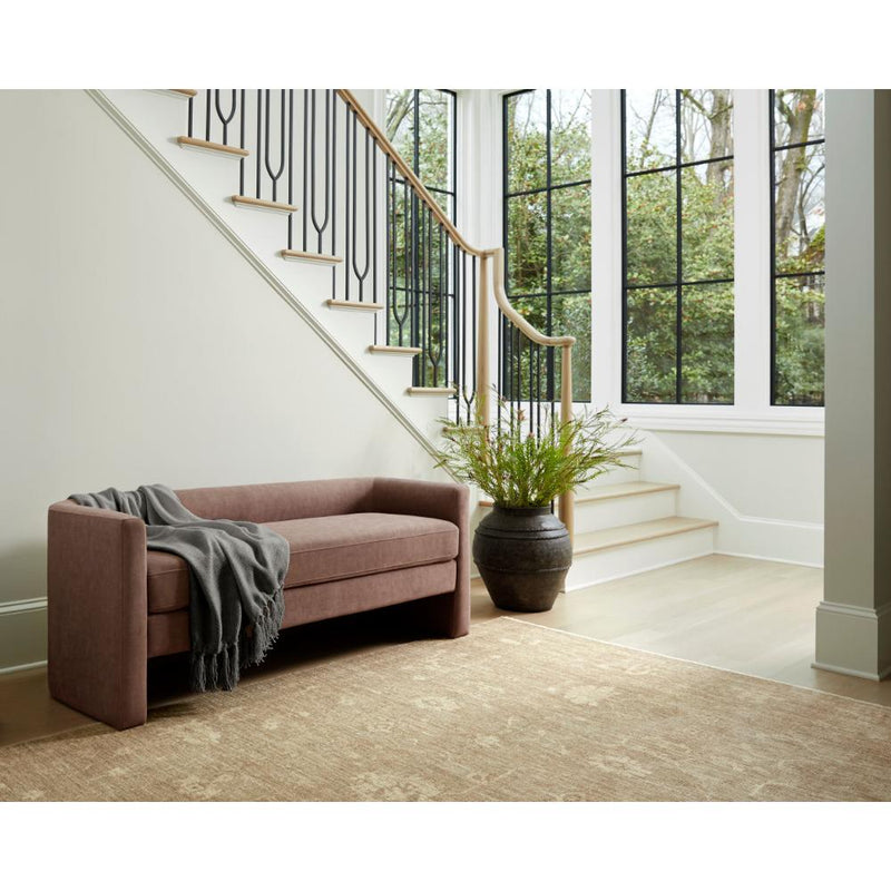 Modern living space with a mauve sofa, gray throw, textured finish, and Surya's Stevi Ceramic Urn near tall windows.