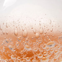 peach clear hand-blown glass round bulb vase