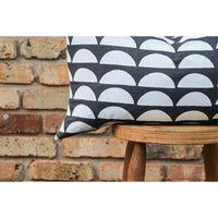 dark gray lumbar pillow white half moons