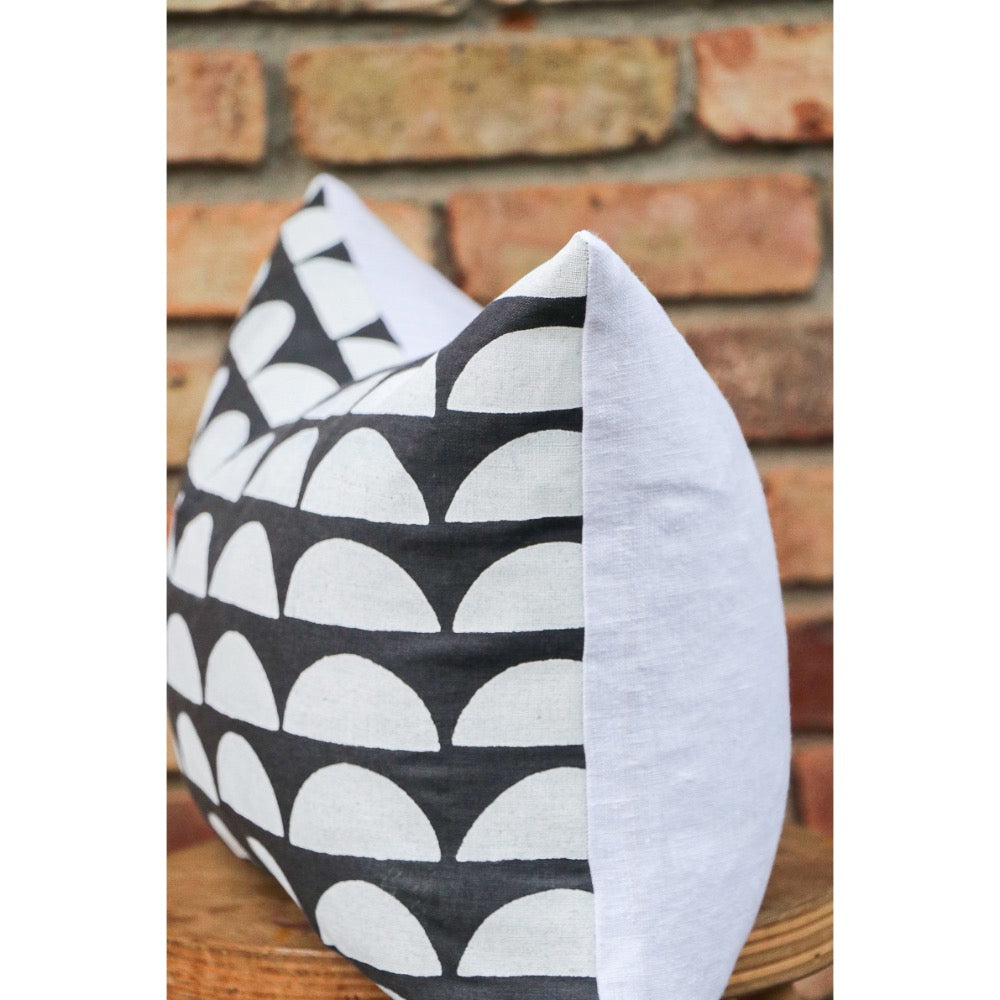 dark gray lumbar pillow white half moons