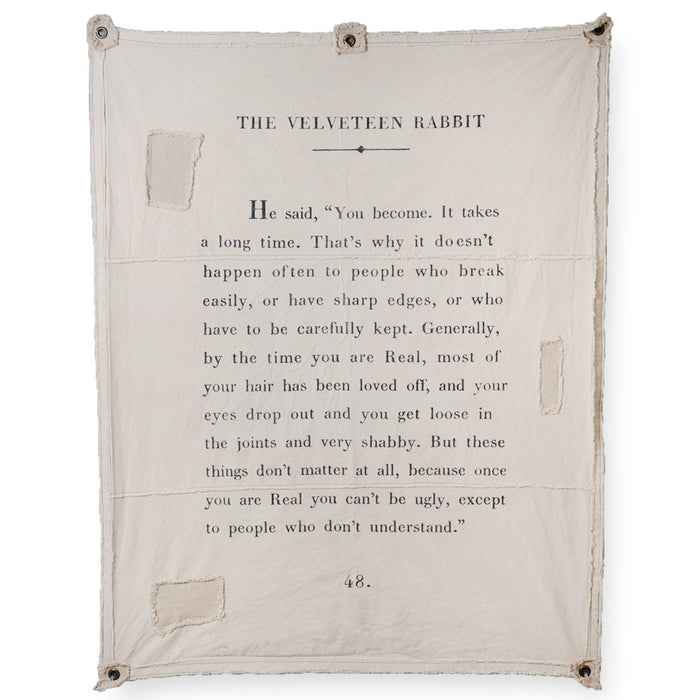 Text from 'The Velveteen Rabbit' on a beige fabric background