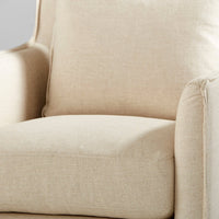 cream slipcovered swivel arm chair