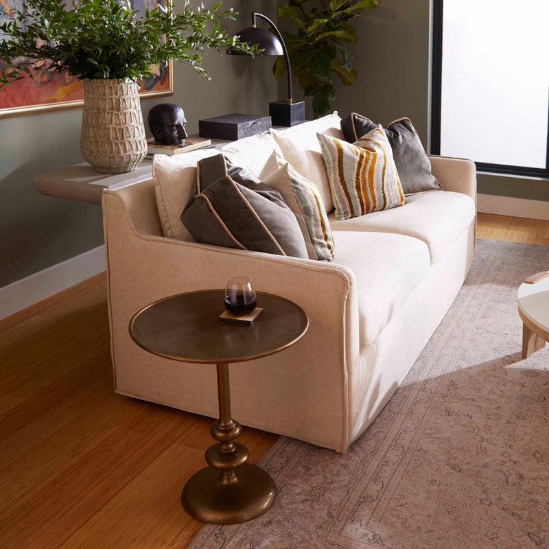 cream slipcovered small 2 cushion sofa