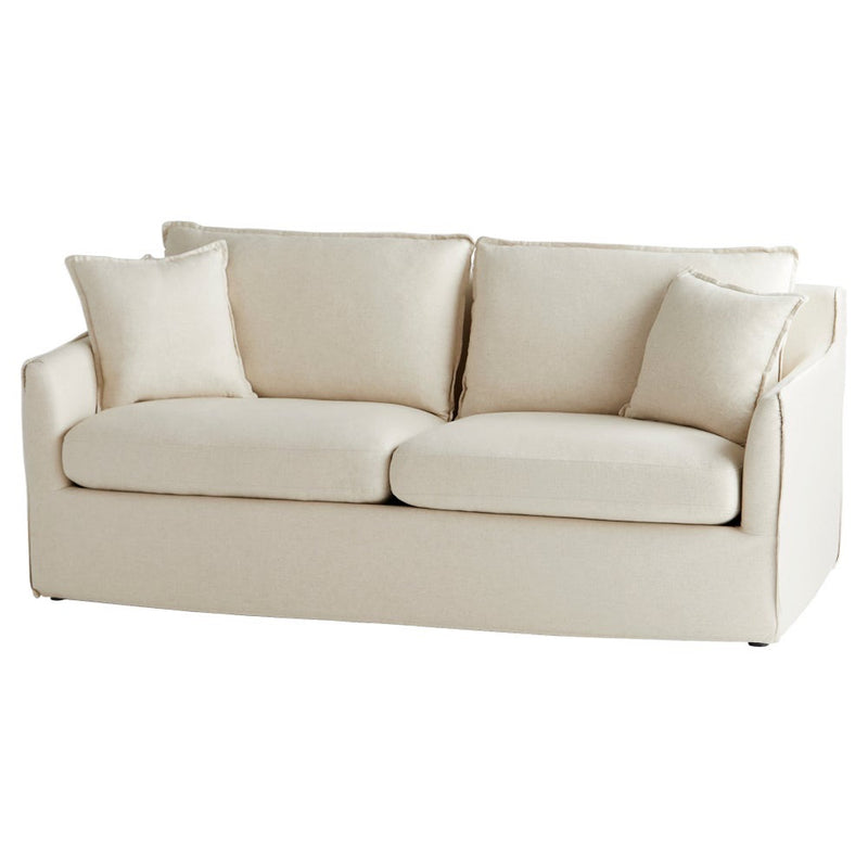 cream slipcovered small 2 cushion sofa