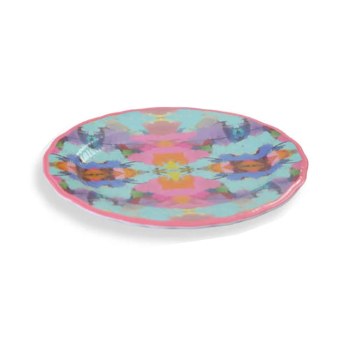 Laura Park Designs Antiqua Smile melamine plate in bright pink and aqua with abstract patterns on a white background.
