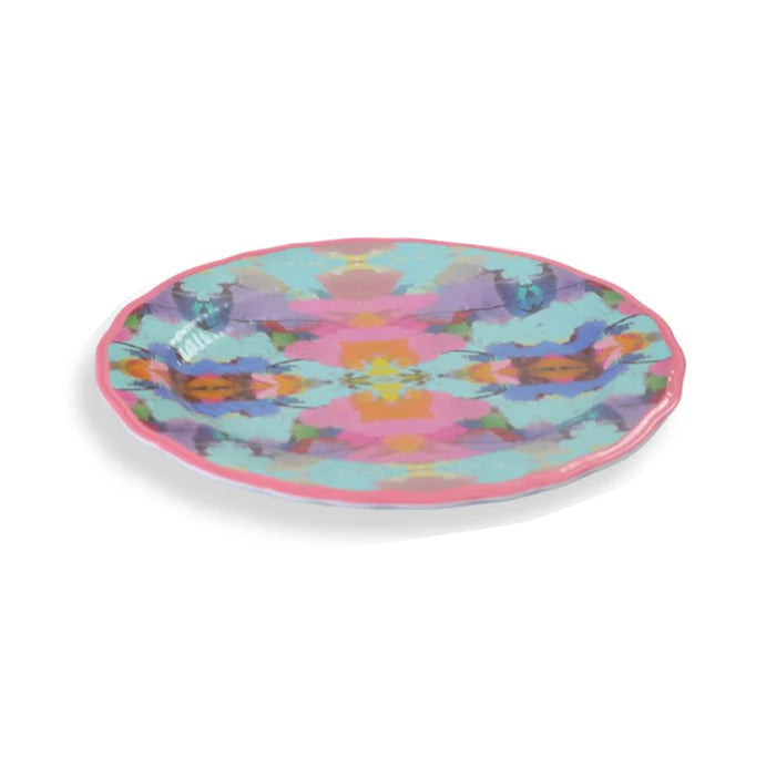 Laura Park Designs Antiqua Smile melamine plate in bright pink and aqua with abstract patterns on a white background.