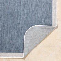 area rug machine woven blue cream edge rounded