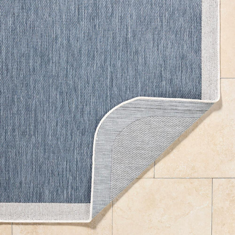 area rug machine woven blue cream edge rounded