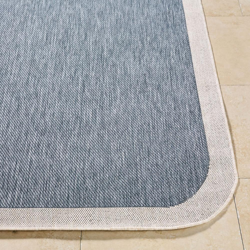 area rug machine woven blue cream edge rounded