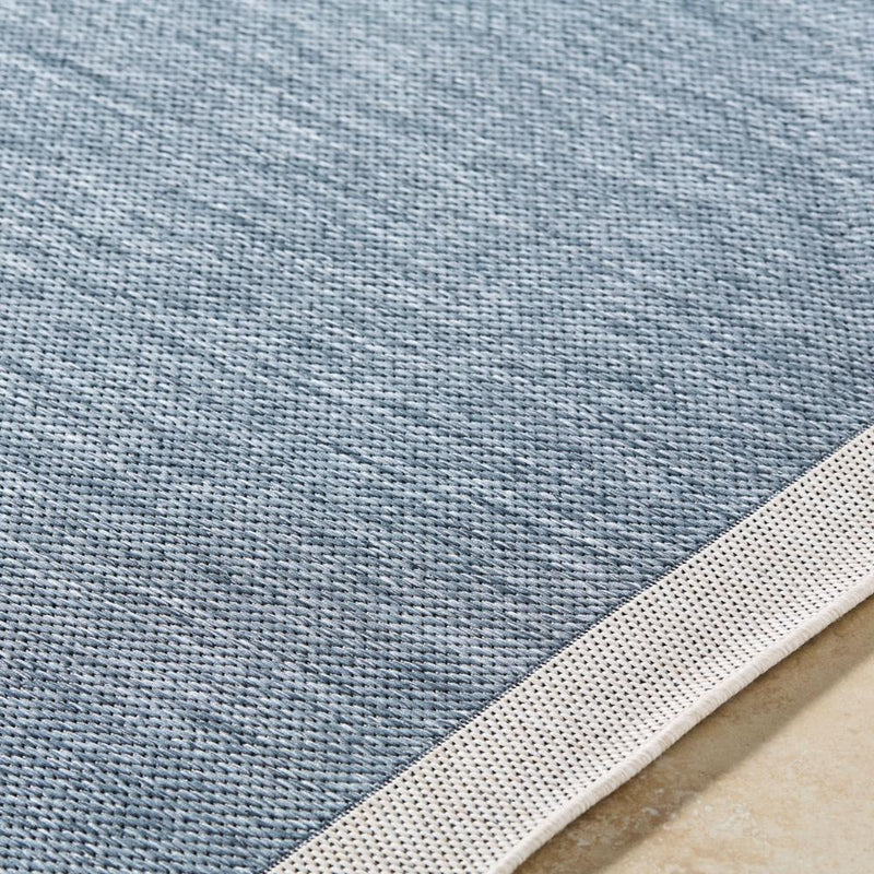 area rug machine woven blue cream edge rounded