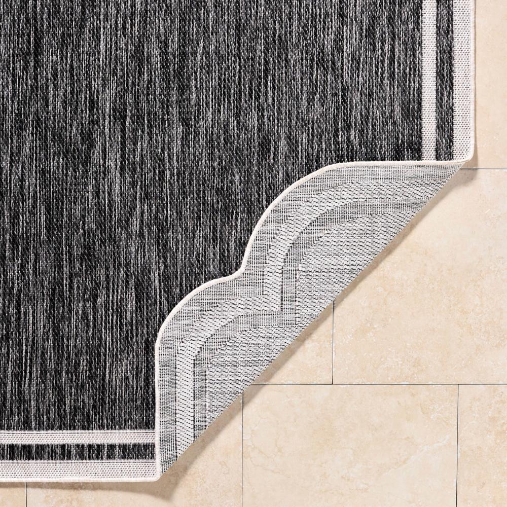 area rug machine woven black white scalloped edge