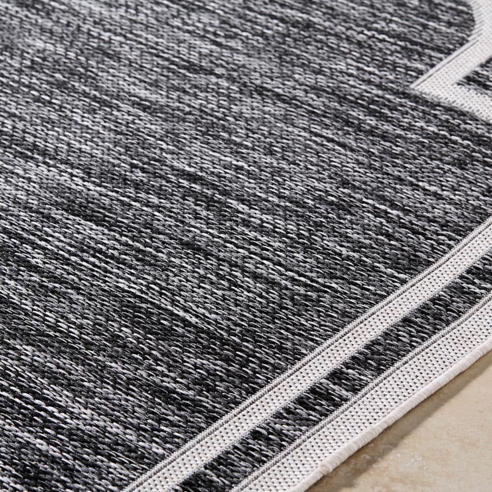 area rug machine woven black white scalloped edge