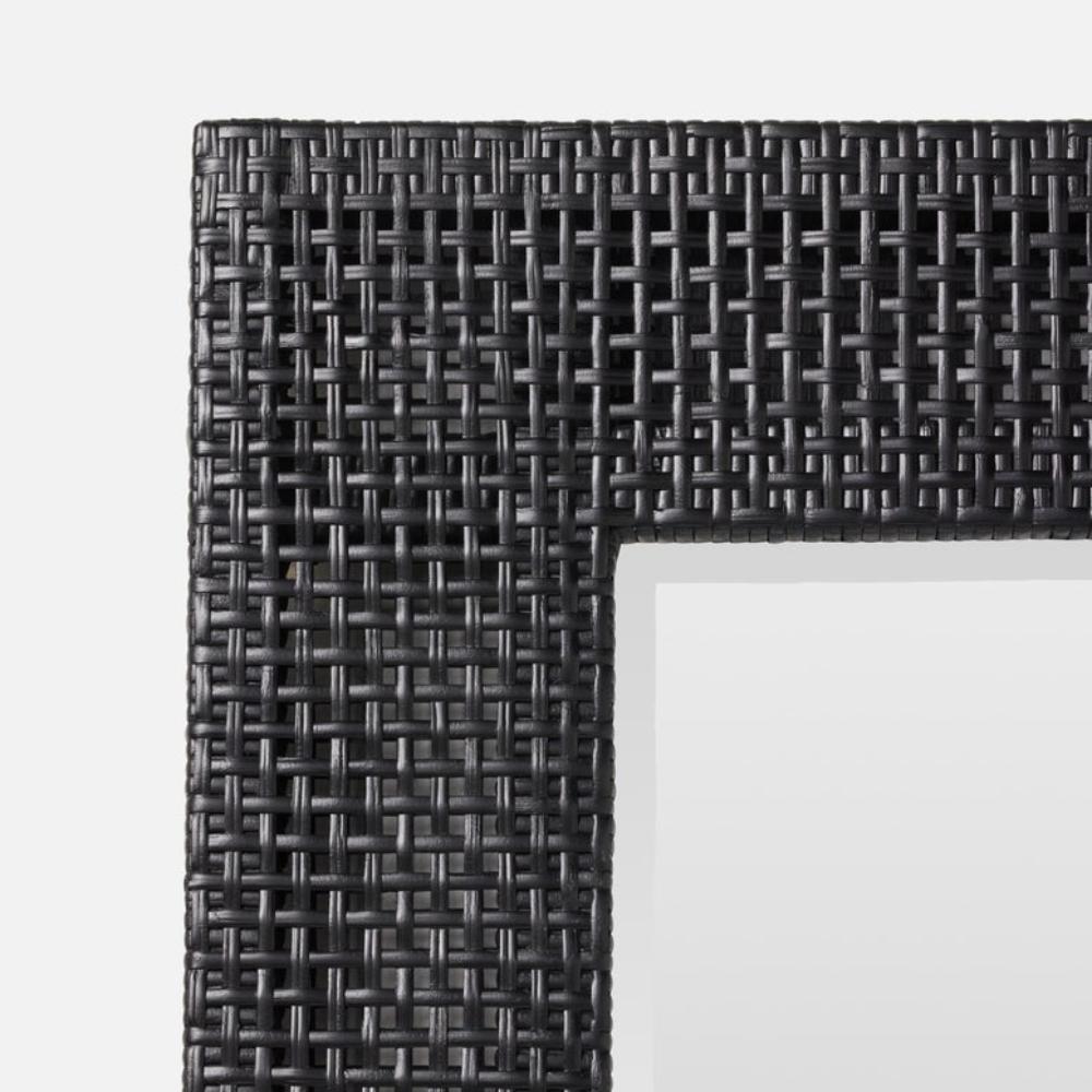 Close-up of a black woven frame on a white background