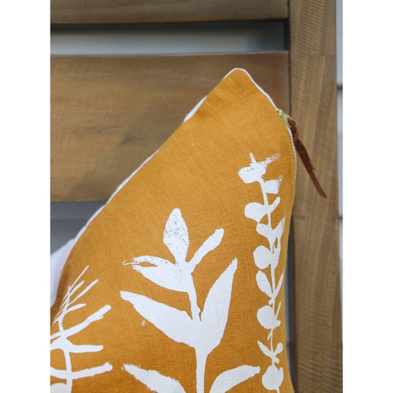 square pillow mustard linen white eucalyptus branches 