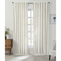 The Stella Ivory Cotton Velvet Curtain Panel by India's Heritage hangs in a bright, modern living room window.
