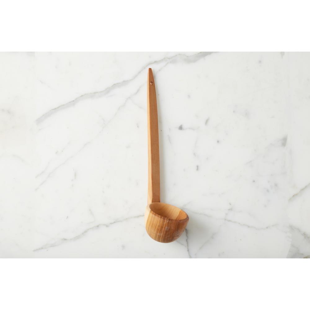 Wooden ladle on a marble surface