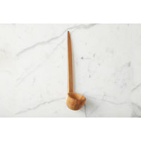 Wooden ladle on a marble surface