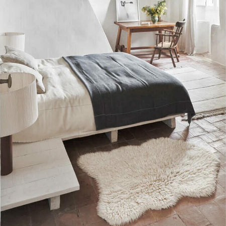white bedroom decor and white faux fur rug 